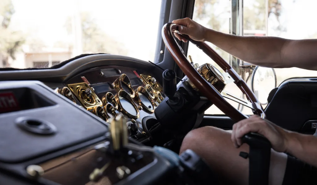 Man driving large truck.