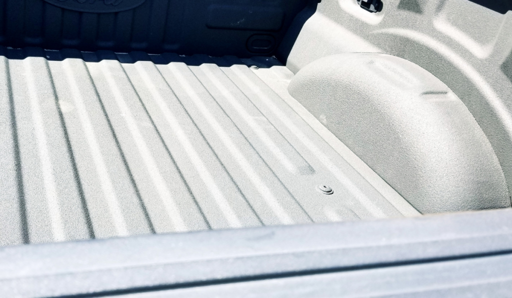 Truck bed, with sprayed in bed liner.