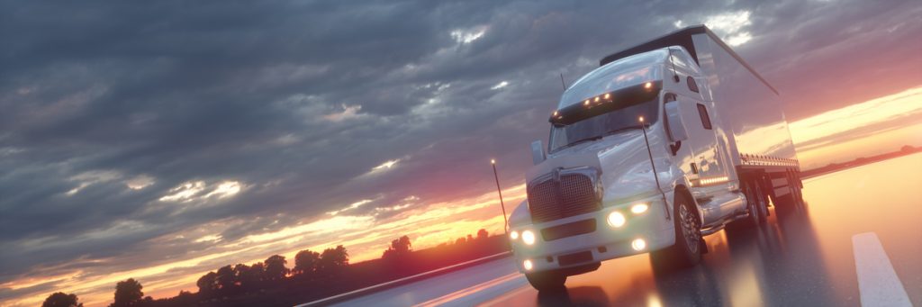 semi-truck motion closeup on highway sunset