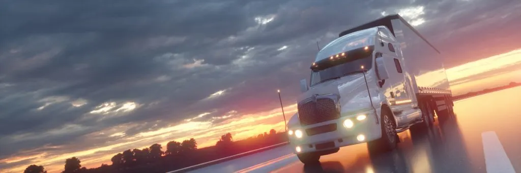 semi-truck motion closeup on highway sunset