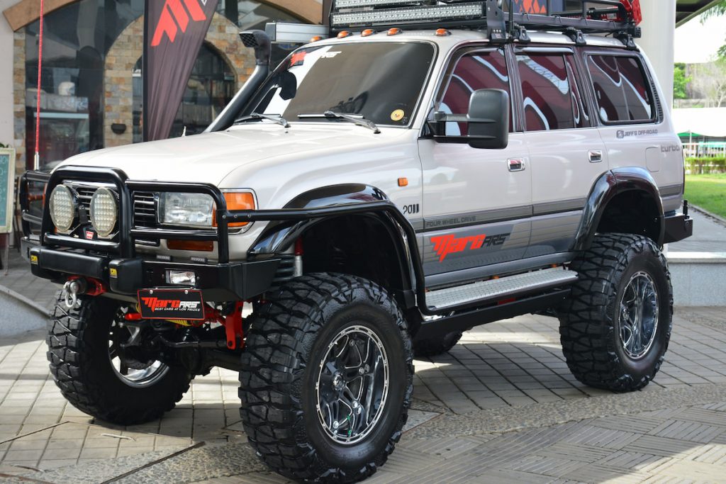 lifted white suv with snorkel