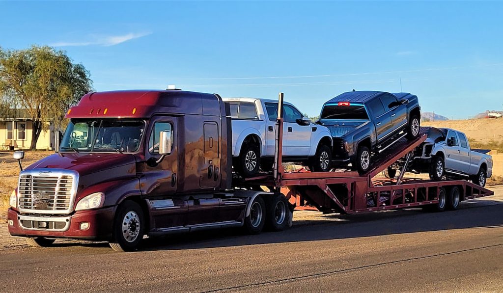pickup-trucks-for-delivery-hauled-by-a-semi