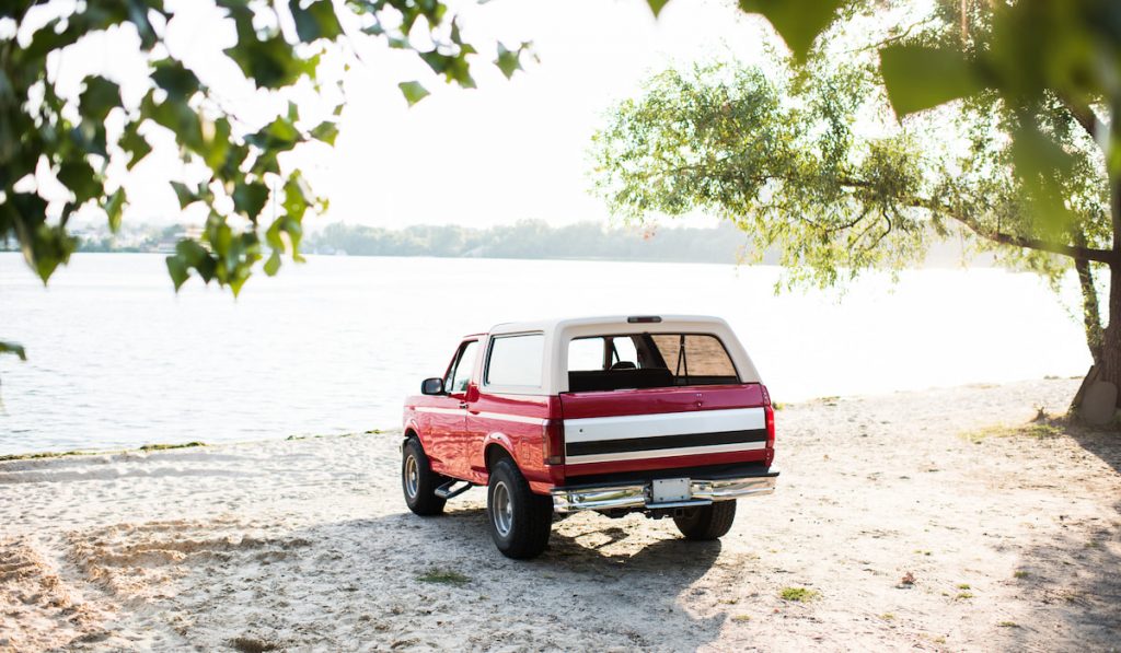 red car on sandy beach