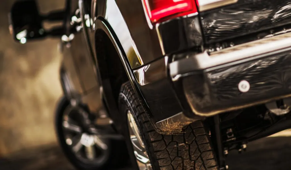 sideview of pickup truck showing proper tires